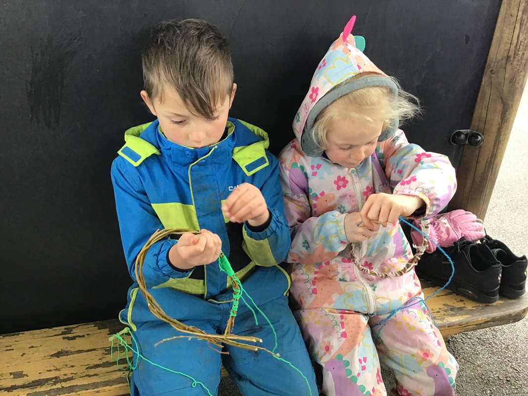 Class 1 Forest school making wreaths
